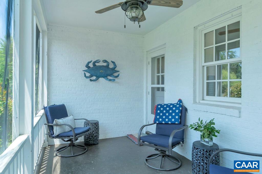 1500 Rugby Avenue Charlottesville, VA 22903 - Photo 46 of 50 a living room with furniture and a potted plant