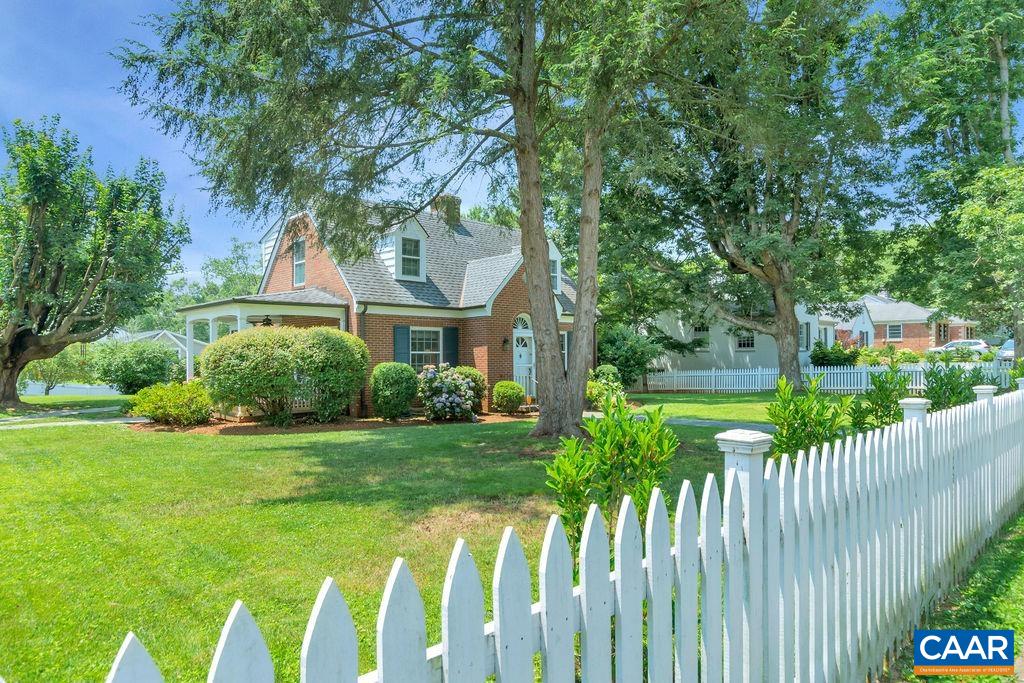 1500 Rugby Avenue Charlottesville, VA 22903 - Photo 5 of 50 a front view of a house with a yard table and chairs