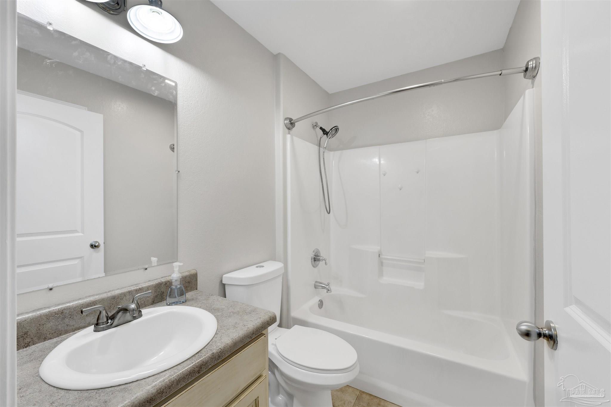 3351 North Simmons Road Jay, FL 32565 - Photo 23 of 36 a bathroom with a sink toilet and shower