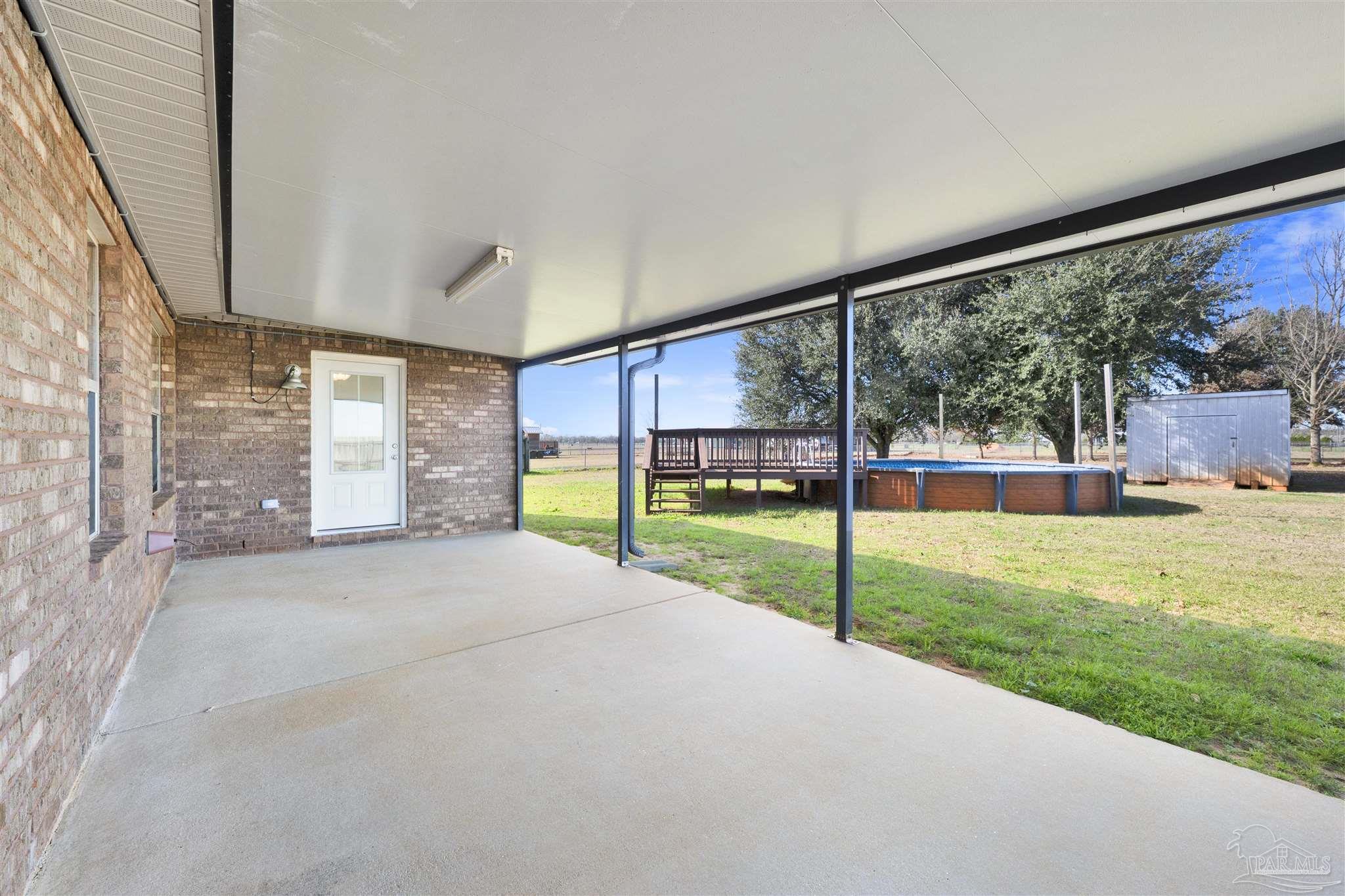3351 North Simmons Road Jay, FL 32565 - Photo 25 of 36 a view of a garden with an outdoor space