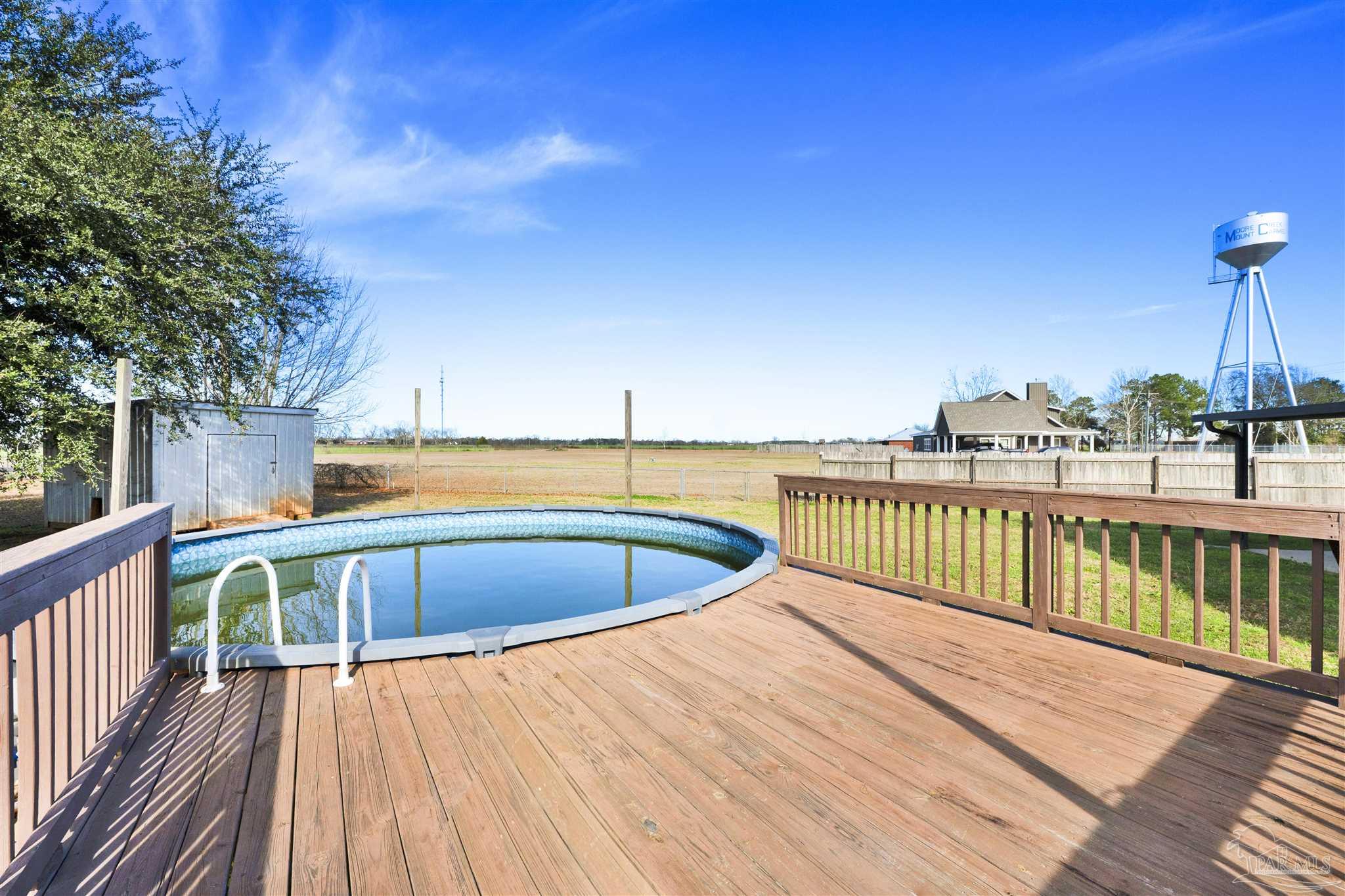 3351 North Simmons Road Jay, FL 32565 - Photo 27 of 36 a view of balcony with wooden floor and seating space