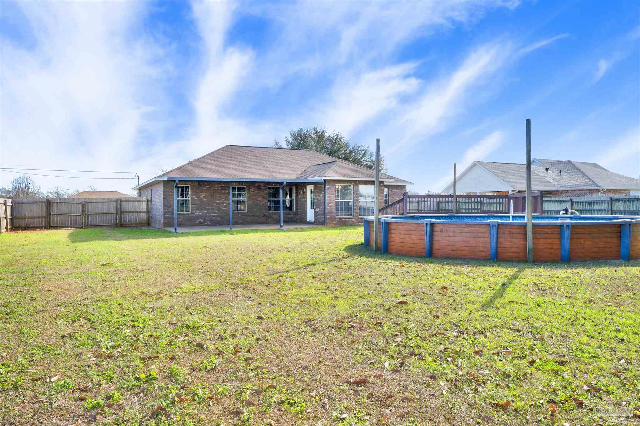 3351 North Simmons Road Jay, FL 32565 - Photo 30 of 36 a view of a house with a yard