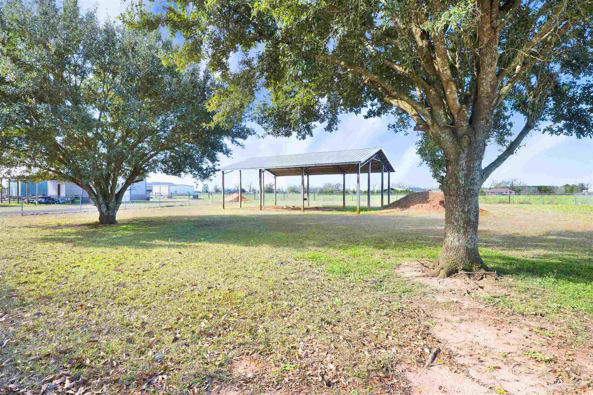 3351 North Simmons Road Jay, FL 32565 - Photo 33 of 36 a house with garden in front of it