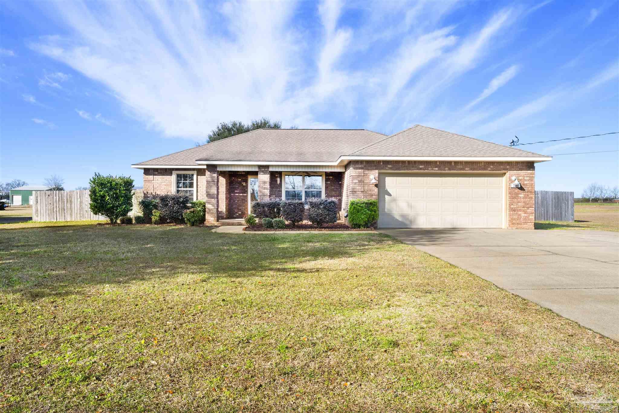 3351 North Simmons Road Jay, FL 32565 - Photo 36 of 36 a front view of a house with a yard
