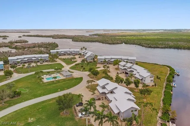 an aerial view of residential houses with outdoor space