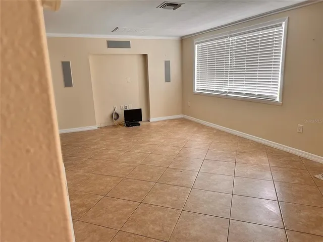 a view of an empty room with a window