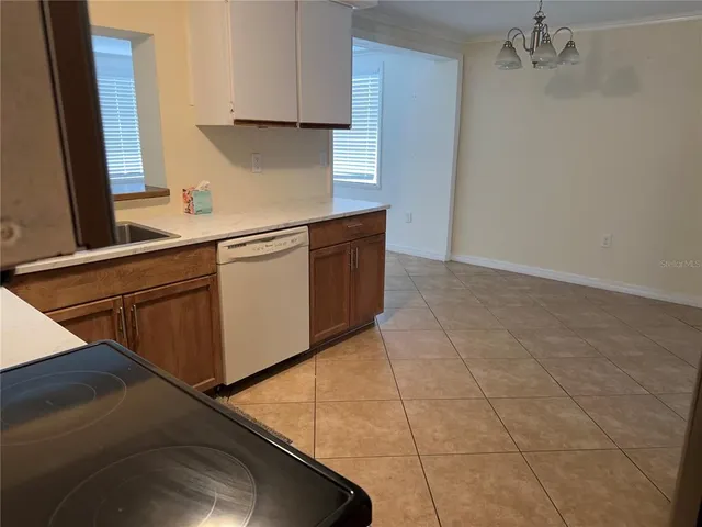 a kitchen with cabinets and a stove