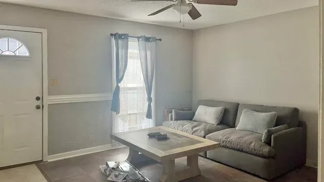 a living room with furniture and a window