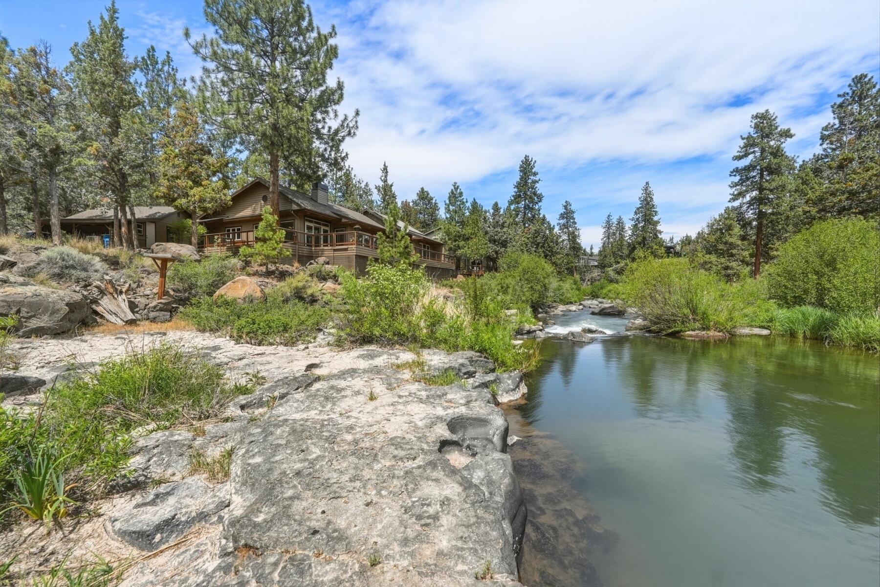 637 Northwest Silver Buckle Road Bend, OR 97703 - Photo 54 of 68 a view of a lake with houses in the back