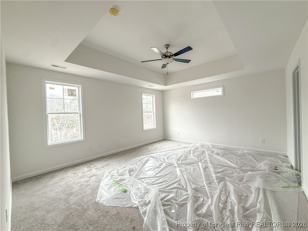 1128 Alex Baker (lot 3) Road Raeford, NC 28376 - Photo 17 of 25 a view of a bedroom with a bed and a window