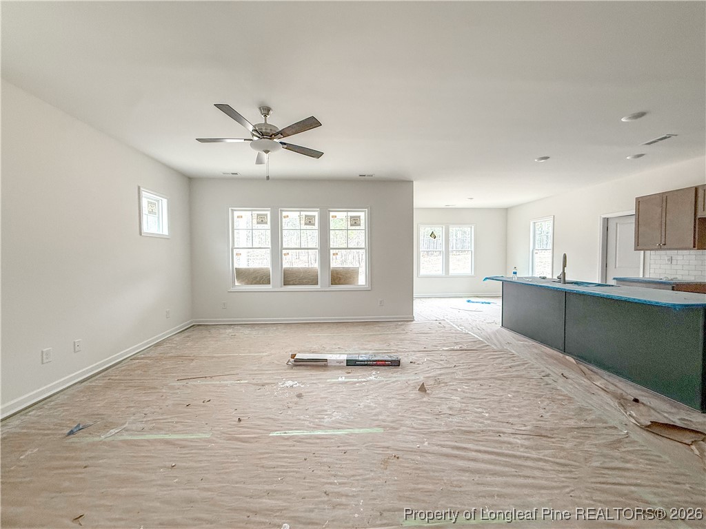 1128 Alex Baker (lot 3) Road Raeford, NC 28376 - Photo 5 of 25 a view of an empty room with a window and a kitchen