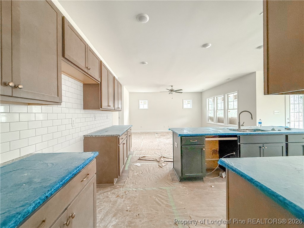 1128 Alex Baker (lot 3) Road Raeford, NC 28376 - Photo 9 of 25 a kitchen with granite countertop cabinets sink and stove