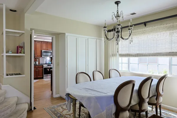 a dining room with furniture and window