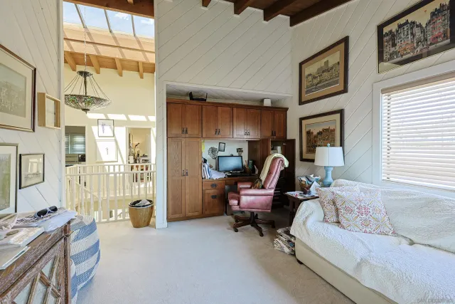 a living room filled with furniture gym equipment and a chandelier