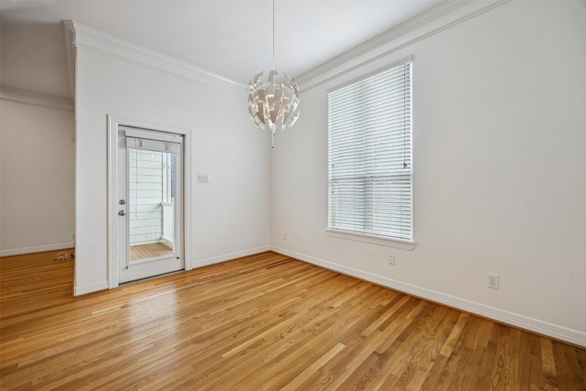 3322 Garden Crest Lane Houston, TX 77018 - Photo 12 of 31 Bright, airy dining room with a glass door leading to a small balcony.
