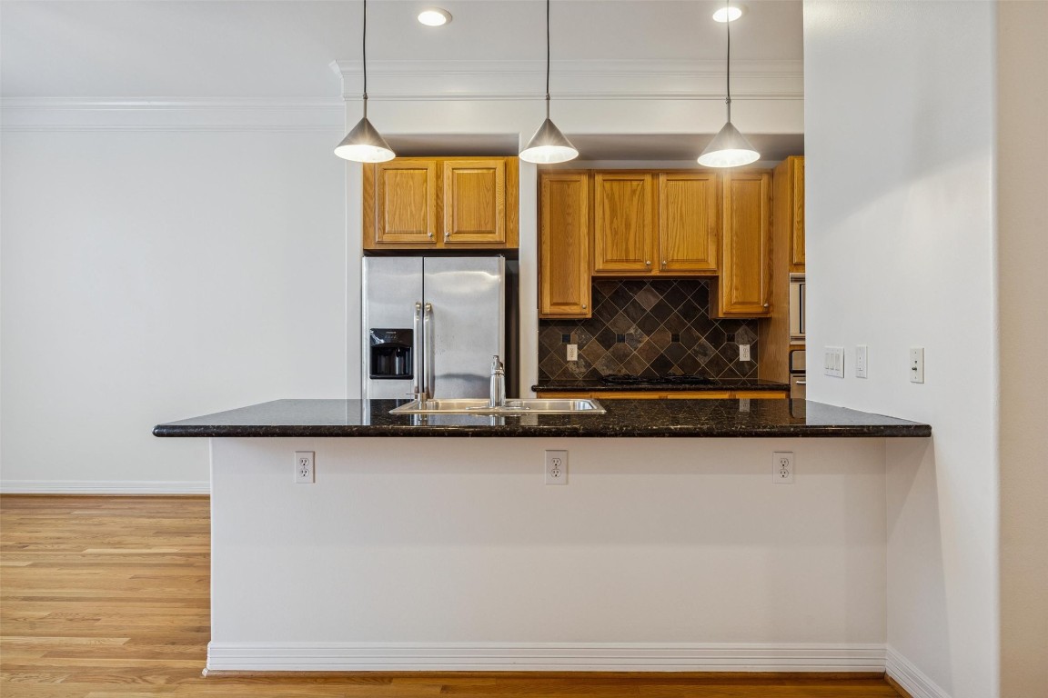 3322 Garden Crest Lane Houston, TX 77018 - Photo 14 of 31 The large black granite island is the perfect spot to enjoy a meal or just keep the cook company!