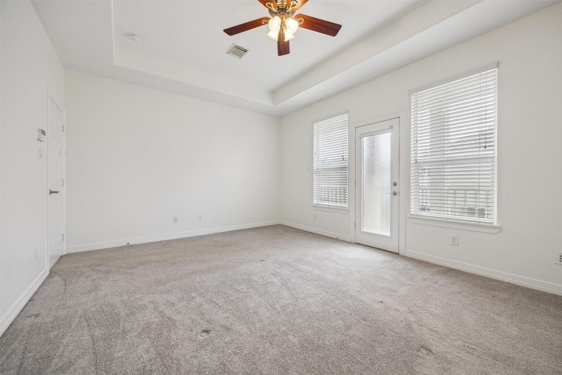 3322 Garden Crest Lane Houston, TX 77018 - Photo 15 of 31 The Primary bedroom is a bright, spacious room with neutral carpeting, a ceiling fan, and large windows and a door leading to your own private balcony.