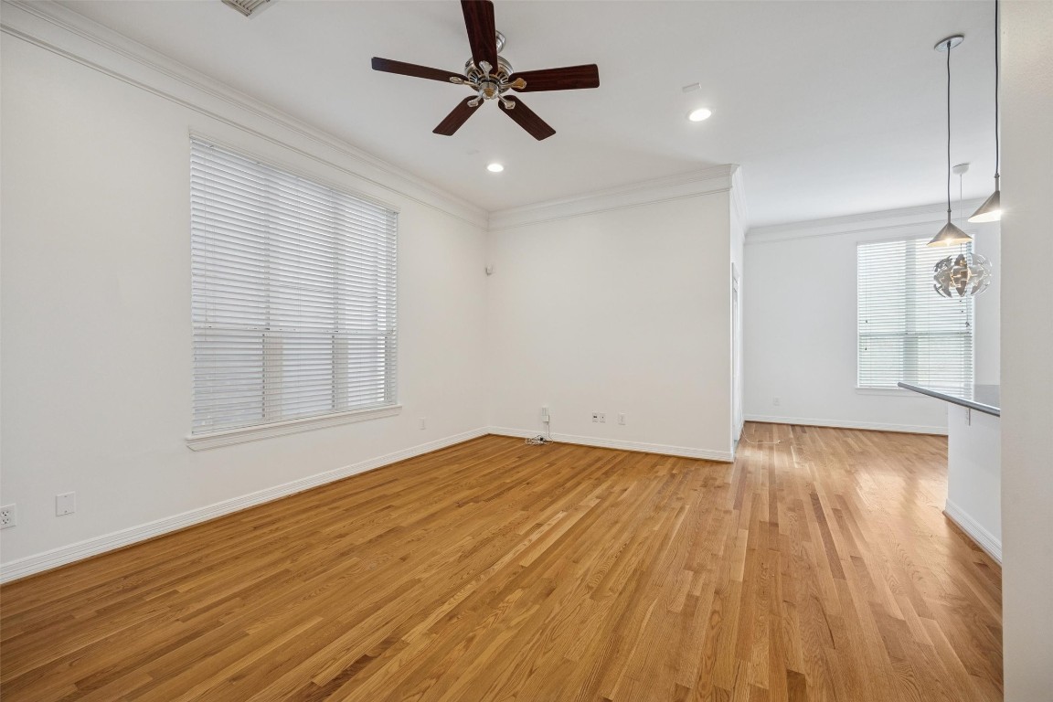 3322 Garden Crest Lane Houston, TX 77018 - Photo 5 of 31 Bright open living space with hardwood floors, large windows, and a ceiling fan. Adjacent to the kitchen and dining areas.