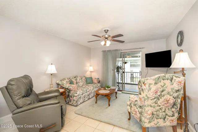 a living room with furniture fireplace and a flat screen tv