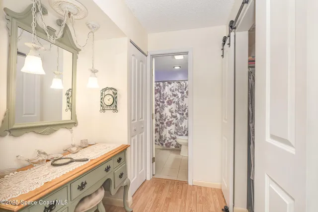 a bathroom with a sink and a mirror with bathtub