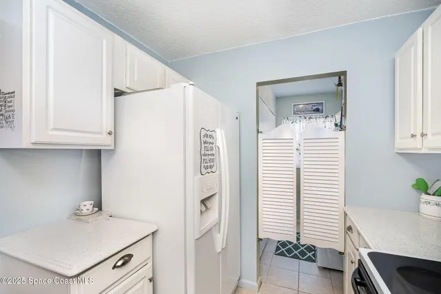 a view of kitchen with furniture and wooden floor