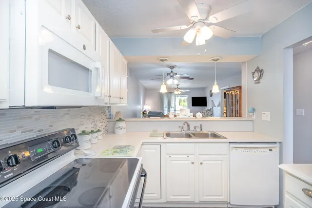 a bathroom with a sink vanity granite tub shower and a mirror