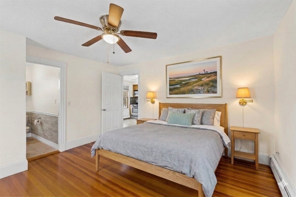15 Hillock Street, Unit 2 Boston, MA 02131 - Photo 16 of 33 a bedroom with a bed and a painting on the wall