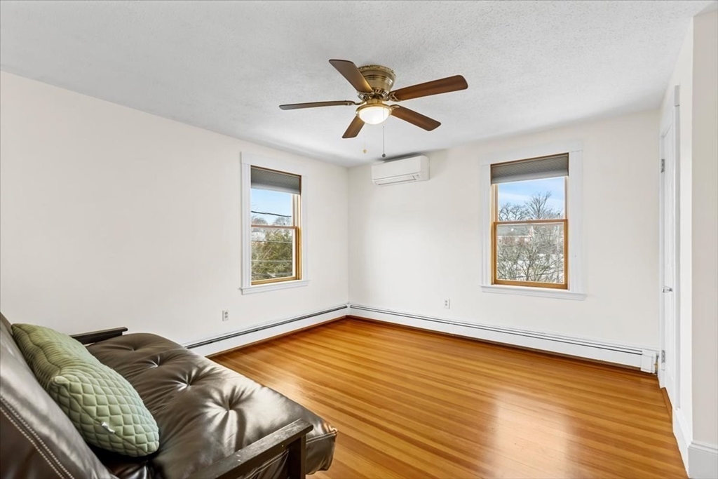 15 Hillock Street, Unit 2 Boston, MA 02131 - Photo 17 of 33 a room with furniture and a window