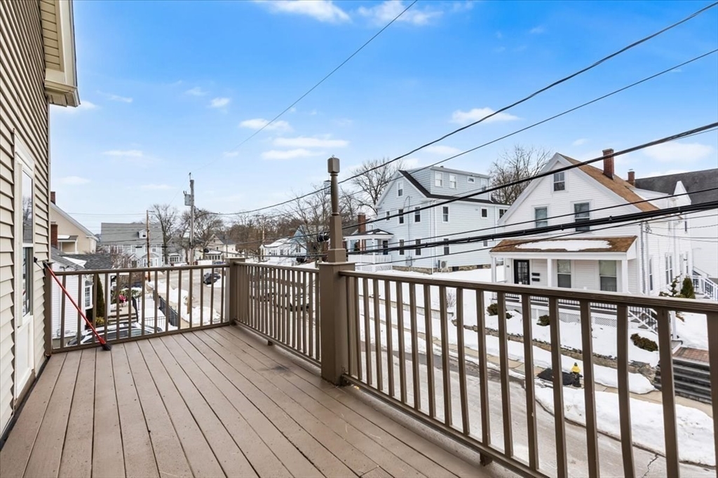 15 Hillock Street, Unit 2 Boston, MA 02131 - Photo 29 of 33 a view of a balcony with wooden floor