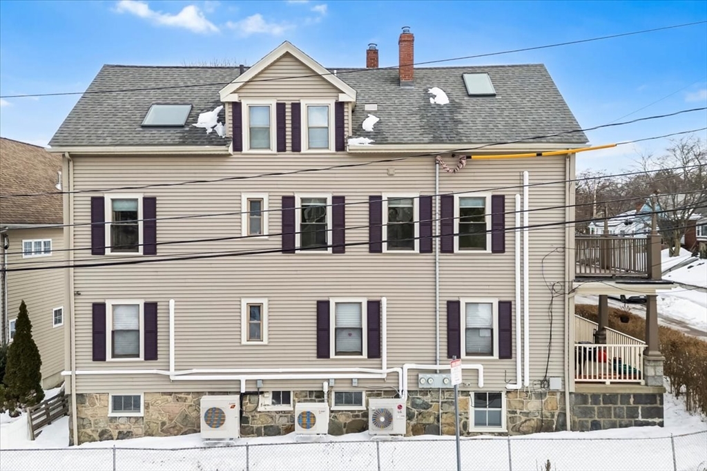15 Hillock Street, Unit 2 Boston, MA 02131 - Photo 31 of 33 a front view of a house with a yard