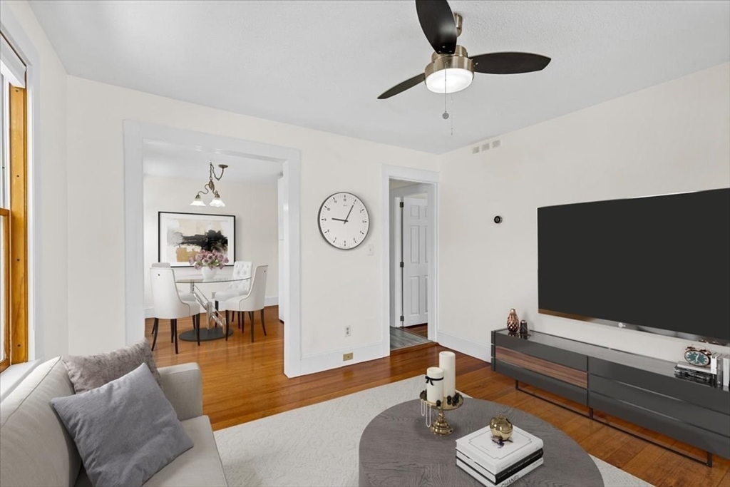 15 Hillock Street, Unit 2 Boston, MA 02131 - Photo 4 of 33 a living room with furniture and a flat screen tv