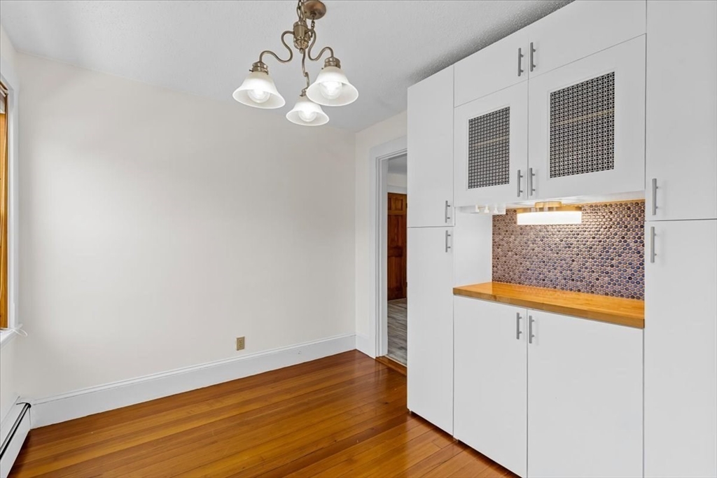 15 Hillock Street, Unit 2 Boston, MA 02131 - Photo 8 of 33 a view of hallway with wooden floor