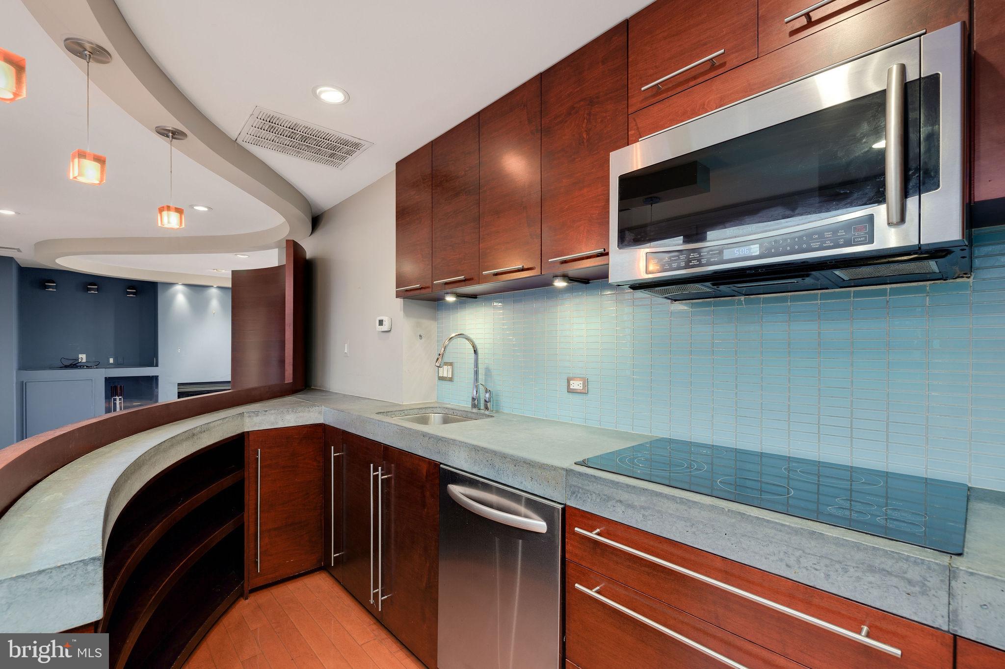 721 D Street Northeast Washington, DC 20002 - Photo 13 of 35 a kitchen with a sink and a microwave