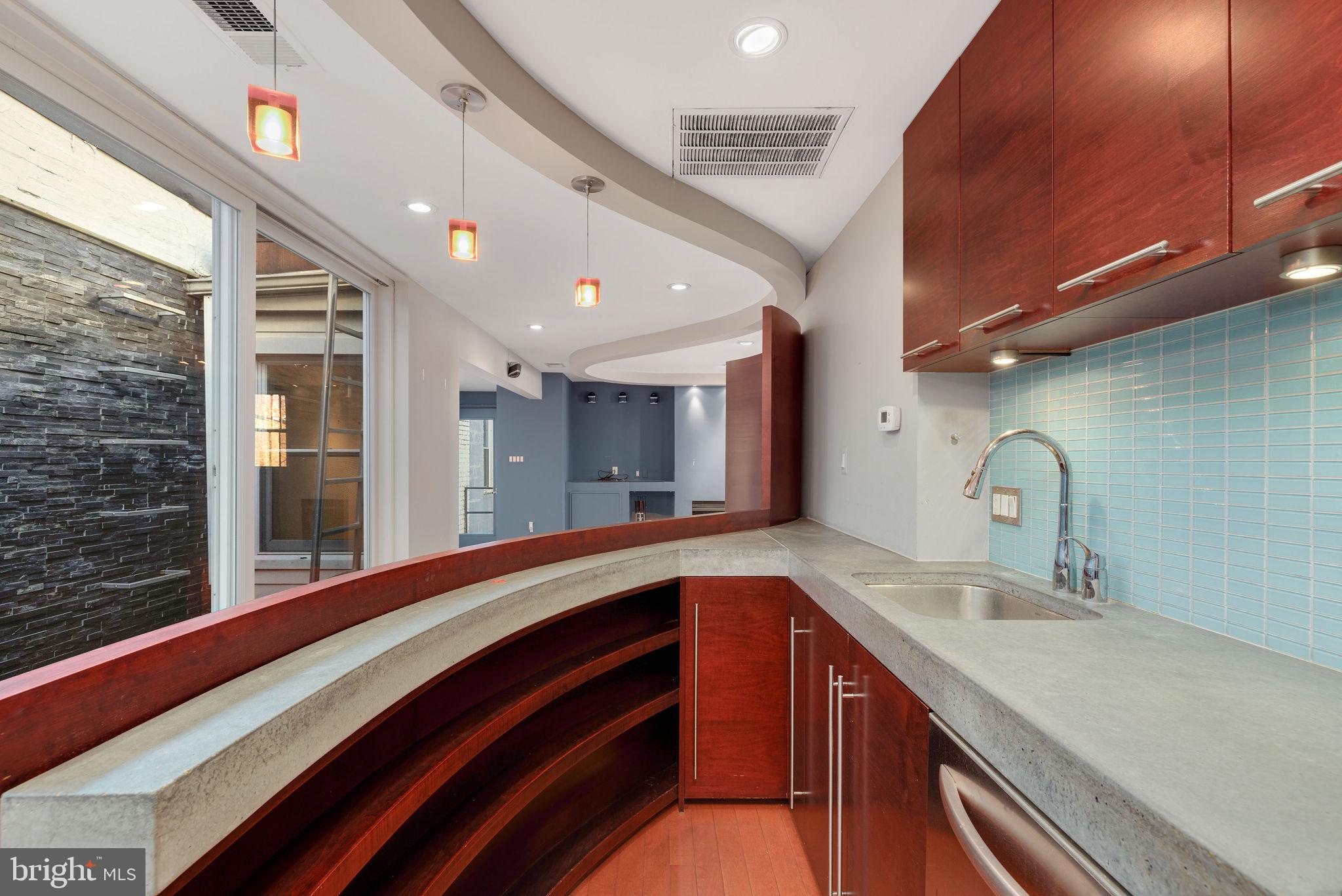 721 D Street Northeast Washington, DC 20002 - Photo 14 of 35 a spacious bathroom with a double vanity sink and a large mirror