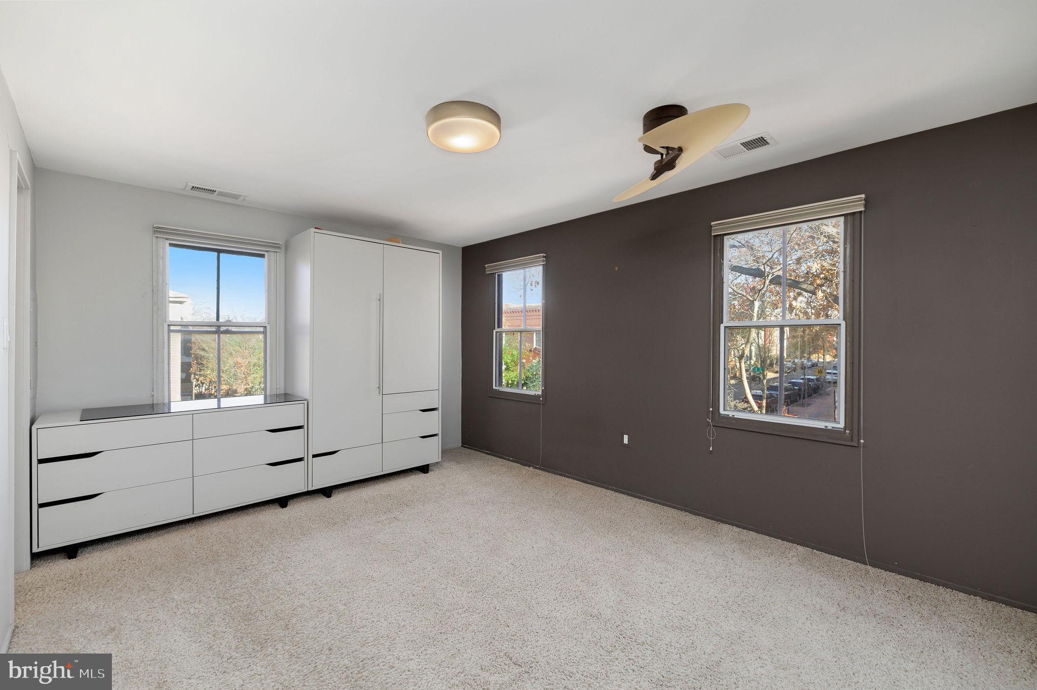 721 D Street Northeast Washington, DC 20002 - Photo 17 of 35 a view of an empty room with window and cabinet