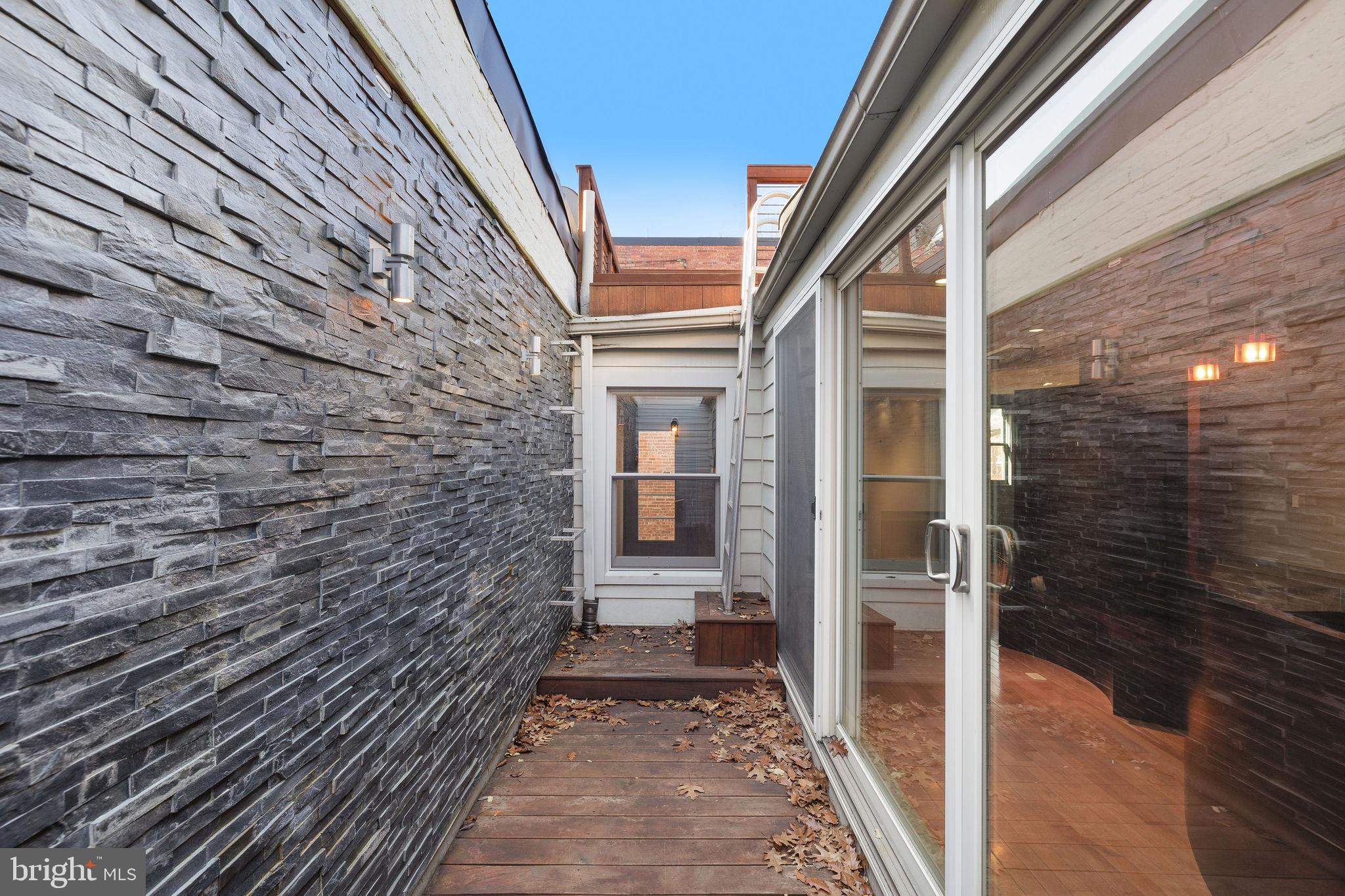 721 D Street Northeast Washington, DC 20002 - Photo 26 of 35 a view of a brick house with a glass door