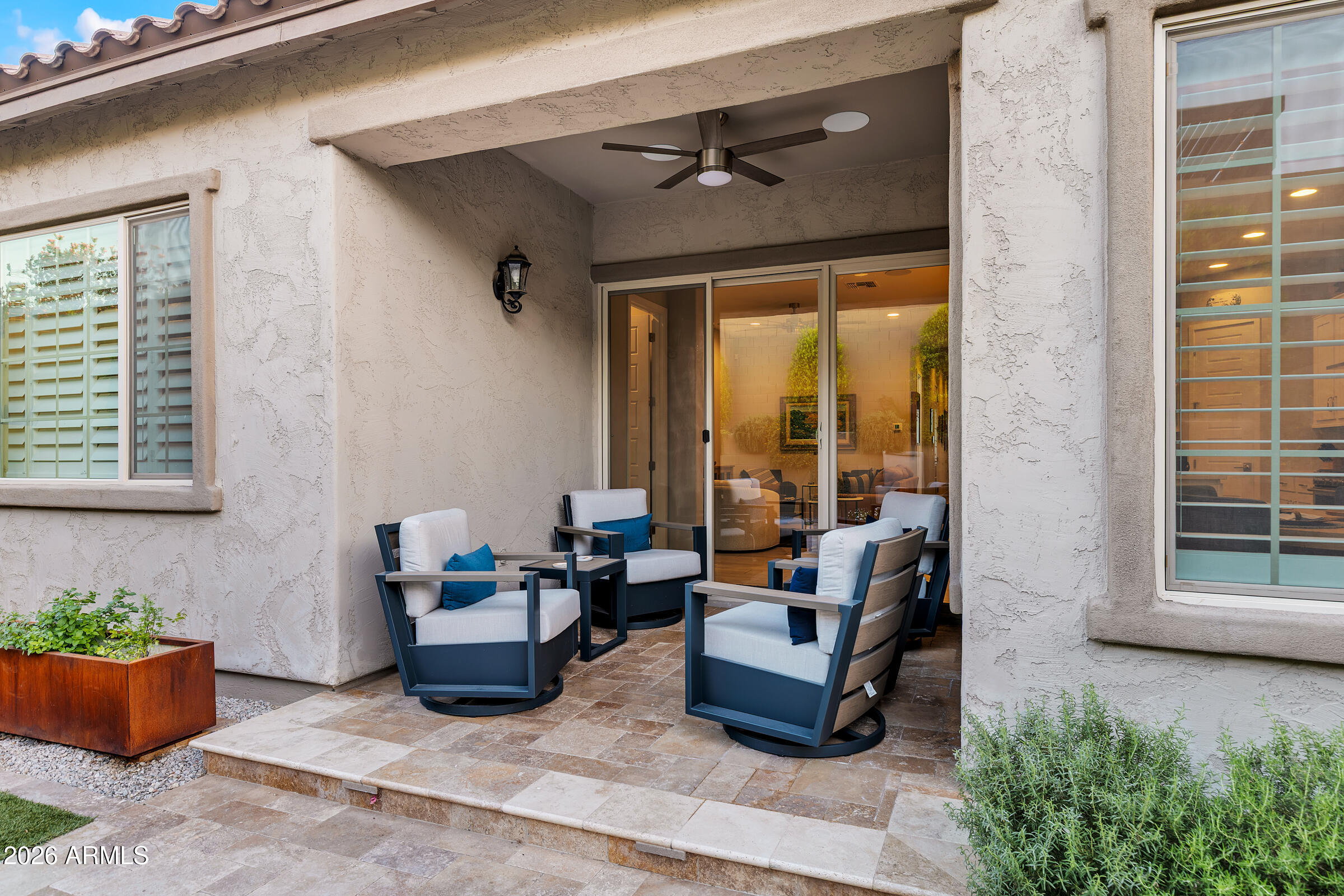 622 West Deer Creek Road Phoenix, AZ 85048 - Photo 33 of 39 a building outdoor space with patio furniture and potted plants