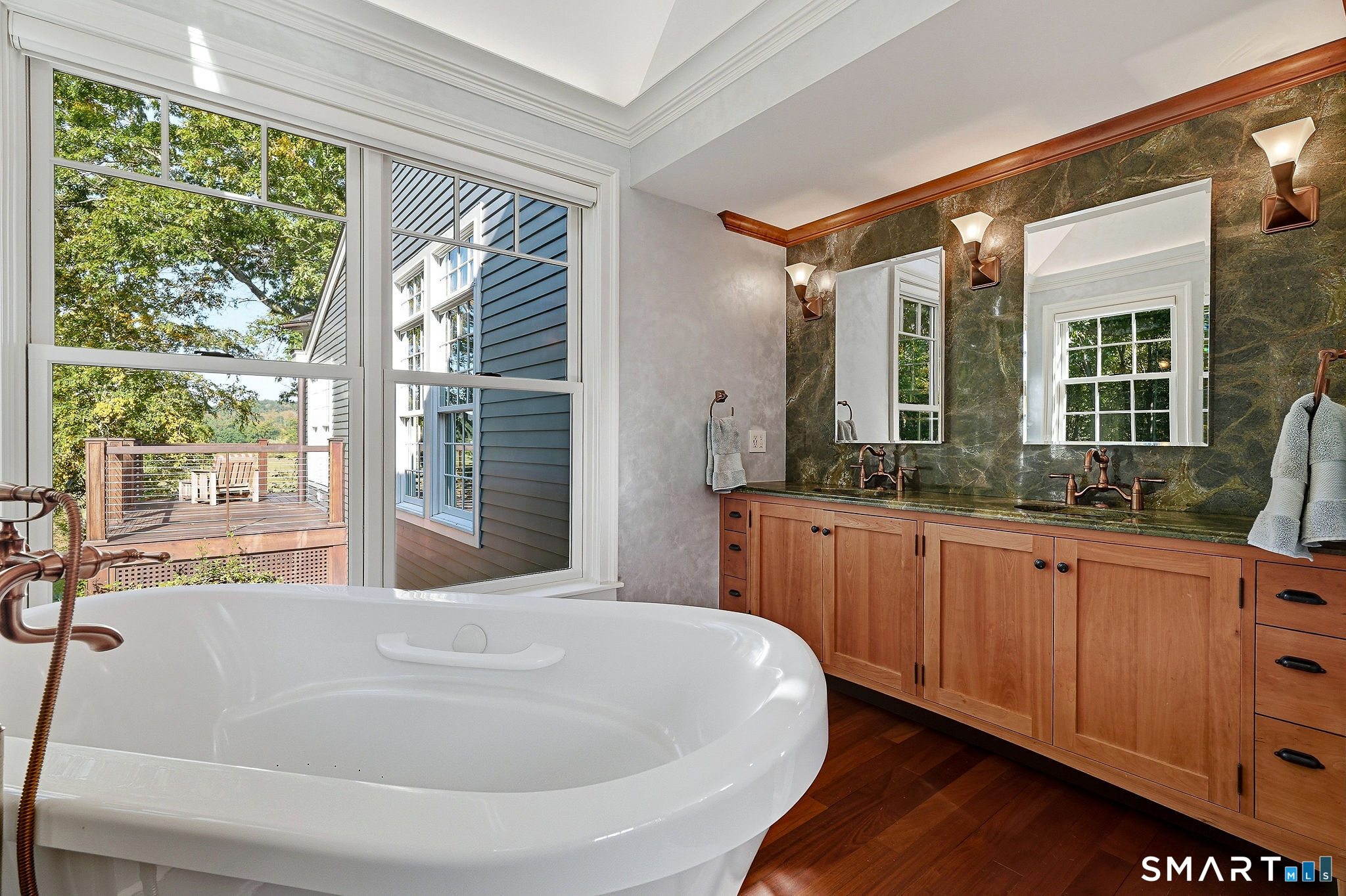484 Joshuatown Road Lyme, CT 06371 - Photo 20 of 40 Granite topped cherry vanity and a tub with a view