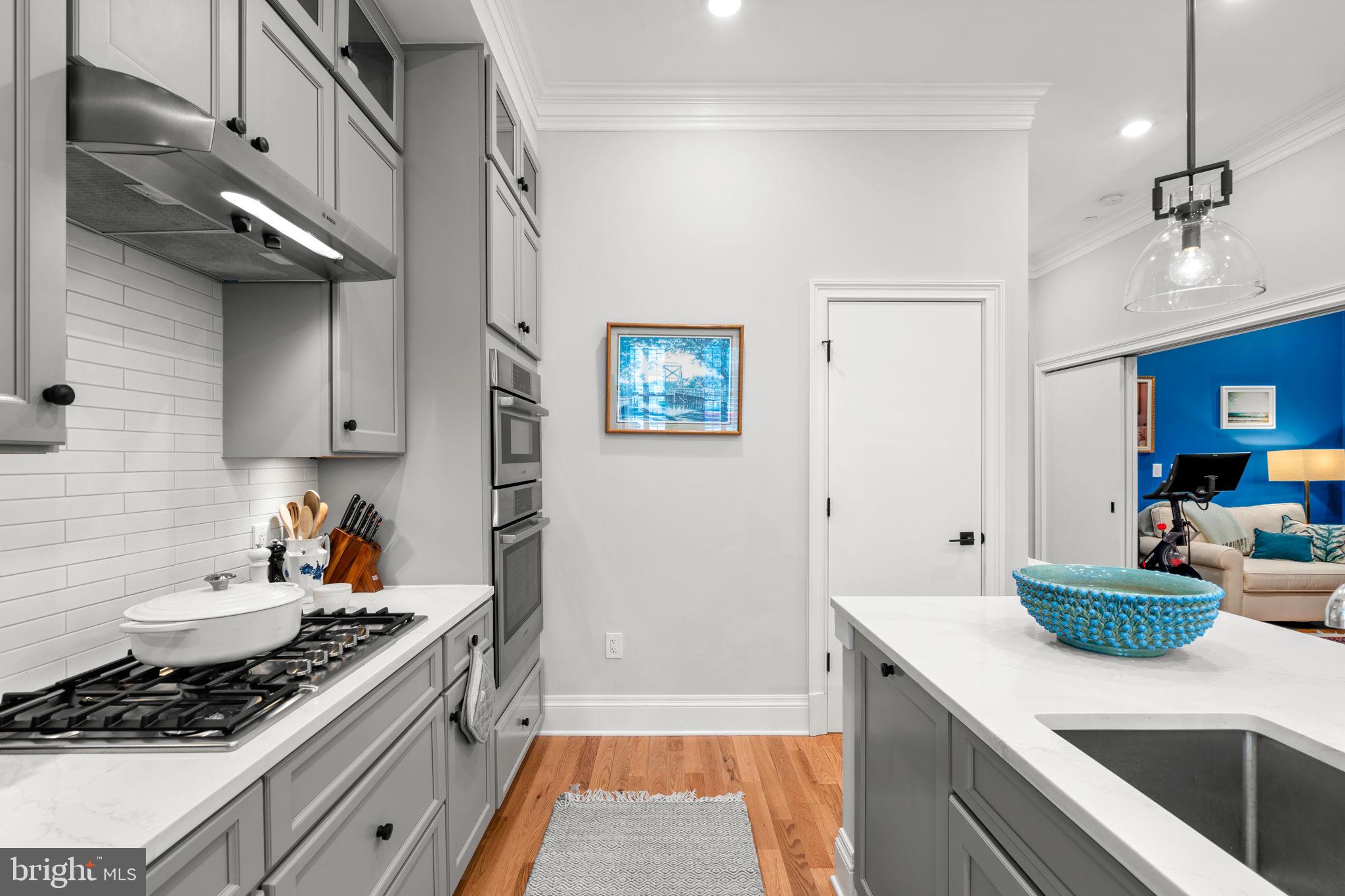 300 8th Street Northeast, Unit 102 Washington, DC 20002 - Photo 17 of 29 a kitchen with stainless steel appliances granite countertop a sink stove and cabinets