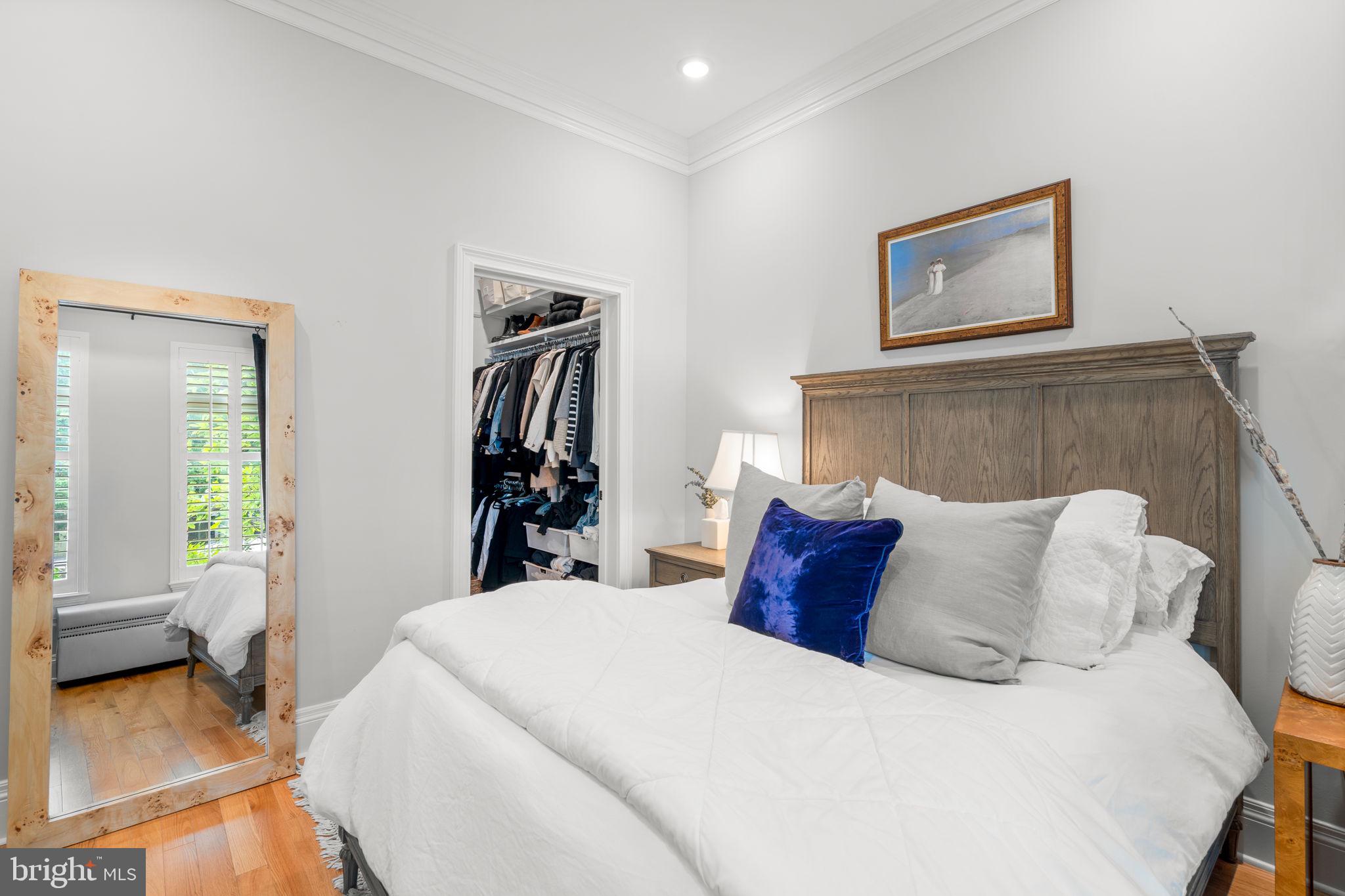 300 8th Street Northeast, Unit 102 Washington, DC 20002 - Photo 28 of 29 a bedroom with a bed and a couch