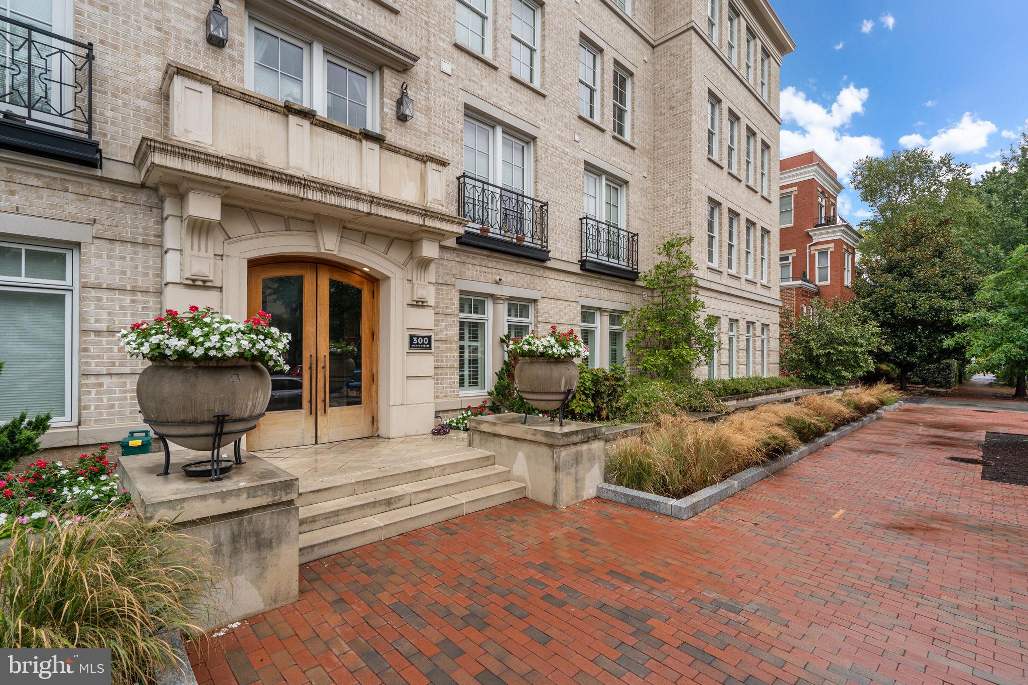 300 8th Street Northeast, Unit 102 Washington, DC 20002 - Photo 3 of 29 a view of a building with potted plants