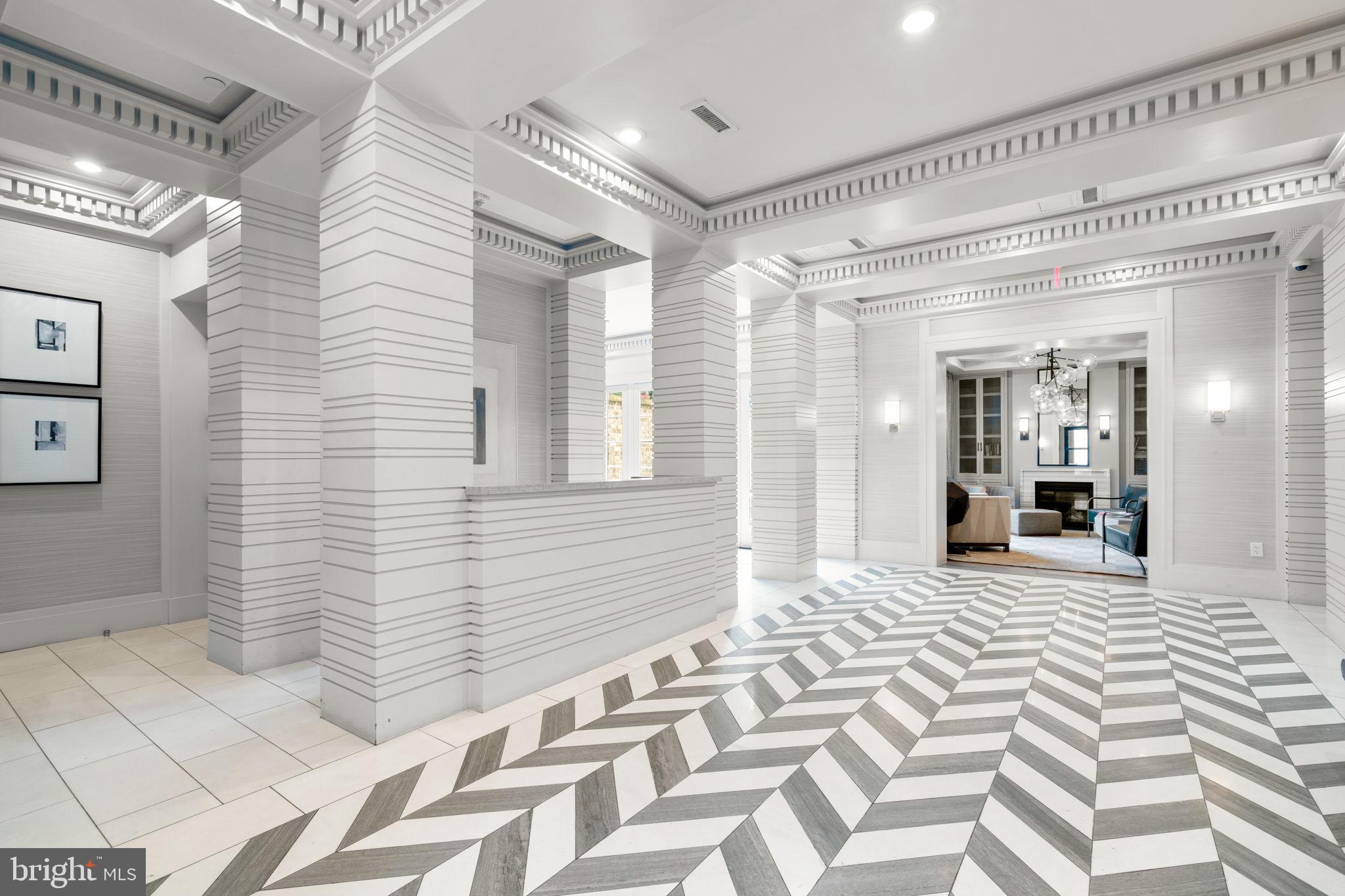 300 8th Street Northeast, Unit 102 Washington, DC 20002 - Photo 4 of 29 a view of a hallway with wooden floor and a bathroom