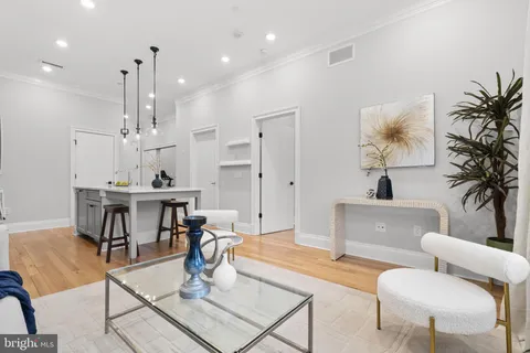 a living room with furniture and a table