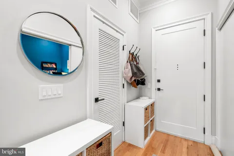 a view of a bathroom with a sink and a mirror