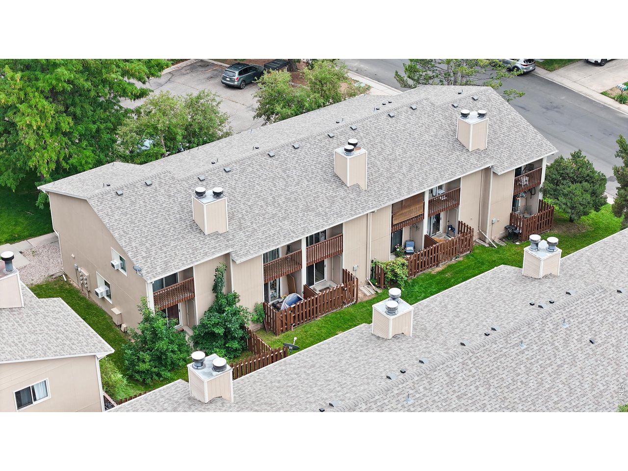 1440 Edora Road, Unit 19 Fort Collins, CO 80525 - Photo 26 of 30 Aerial view shows the townhome's HOA-covered new roof and its place within the well-maintained community