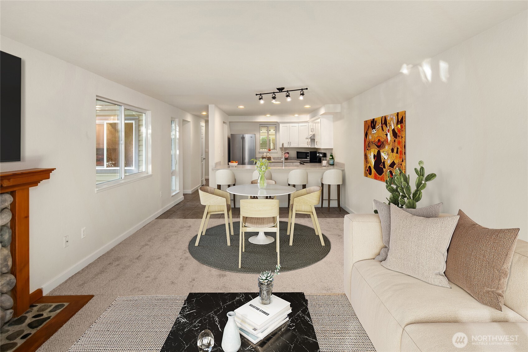 12014 98th Avenue Northeast, Unit 101 Kirkland, WA 98034 - Photo 15 of 33 a living room with furniture and a chandelier