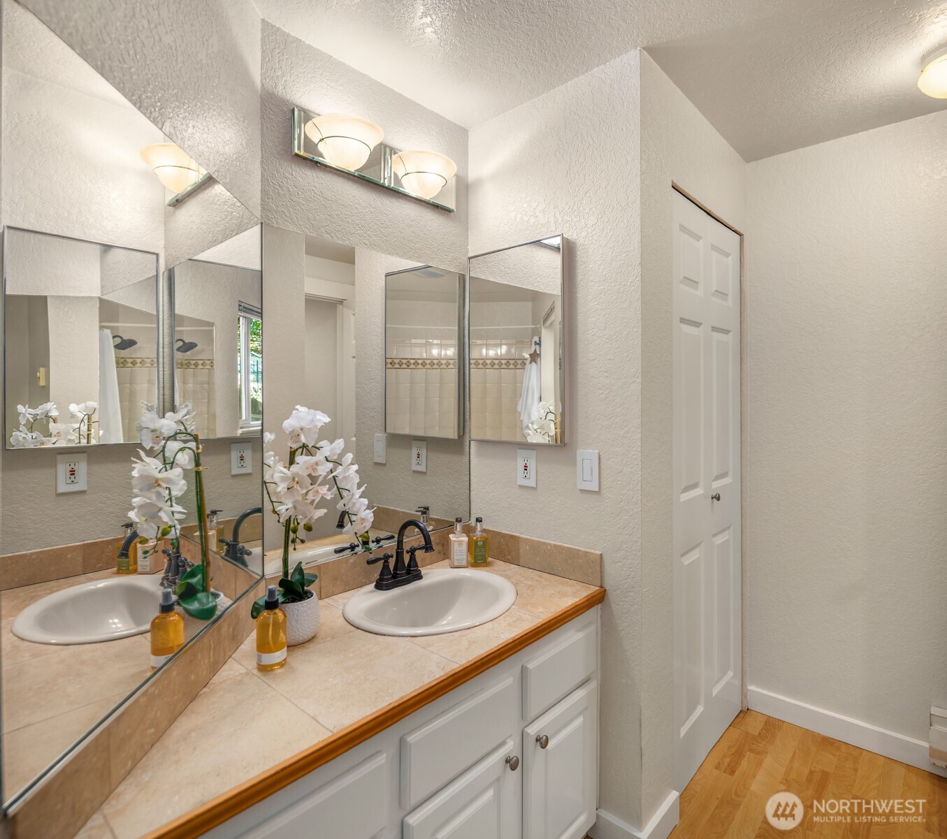 12014 98th Avenue Northeast, Unit 101 Kirkland, WA 98034 - Photo 21 of 33 a bathroom with a sink and a mirror