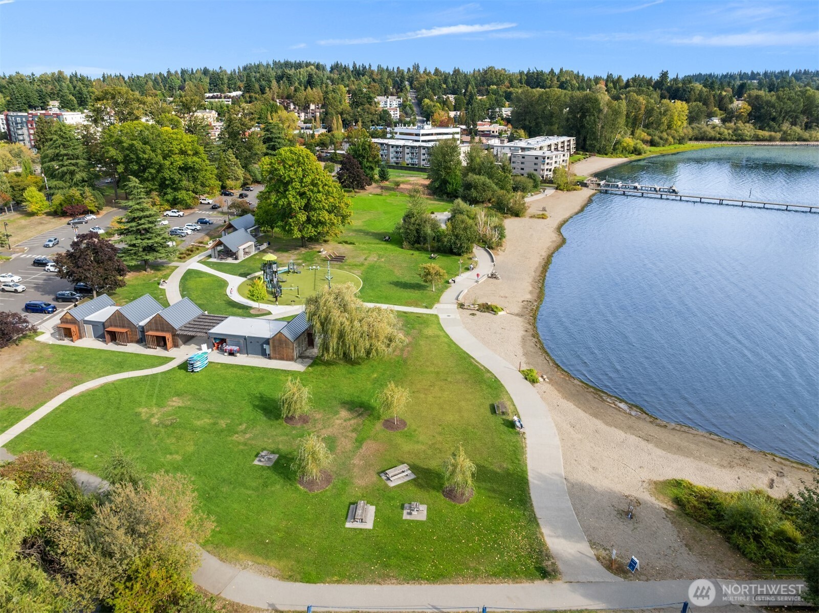12014 98th Avenue Northeast, Unit 101 Kirkland, WA 98034 - Photo 32 of 33 a view of a swimming pool with a yard