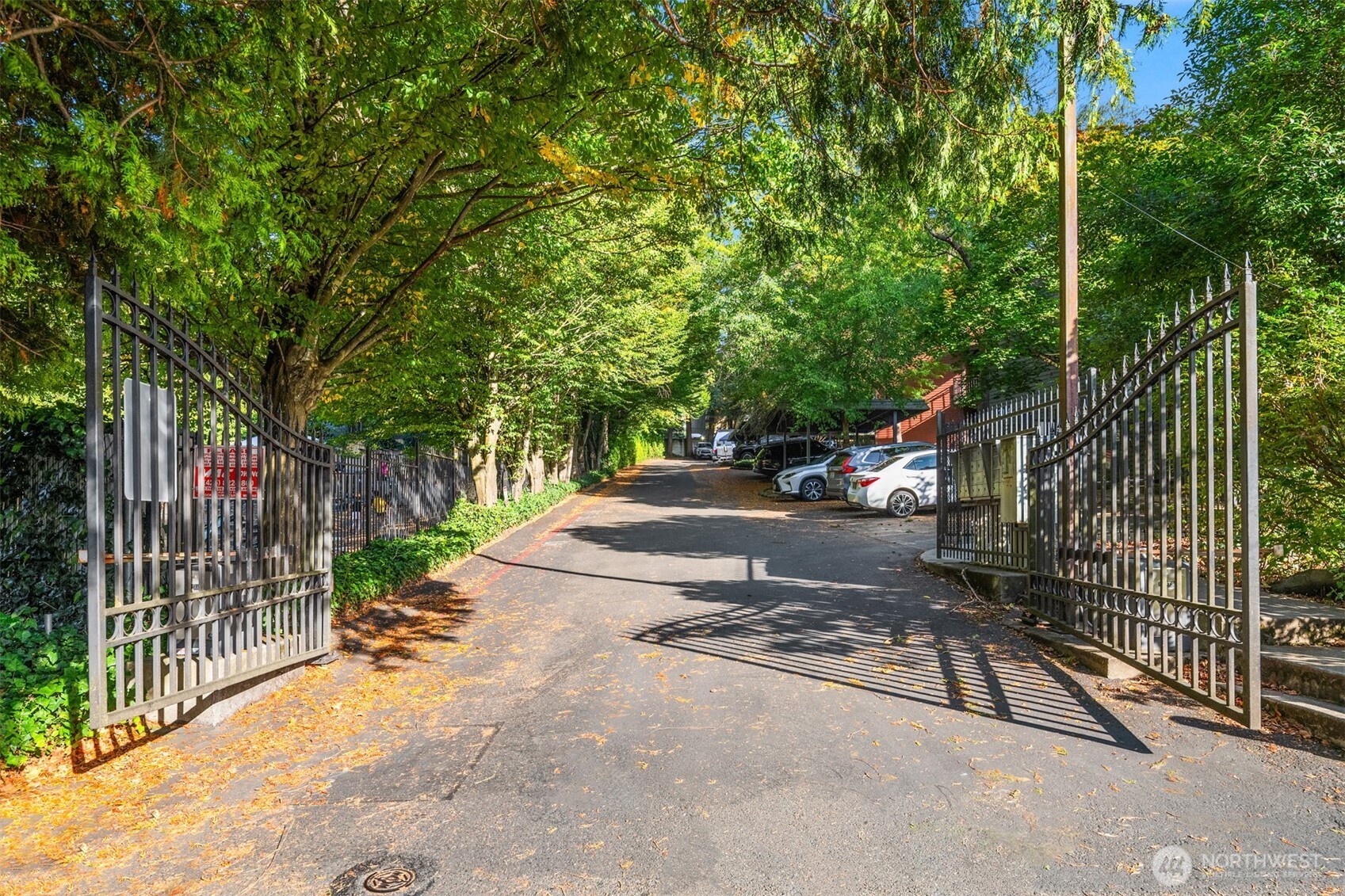 12014 98th Avenue Northeast, Unit 101 Kirkland, WA 98034 - Photo 4 of 33 a view of street next to a yard