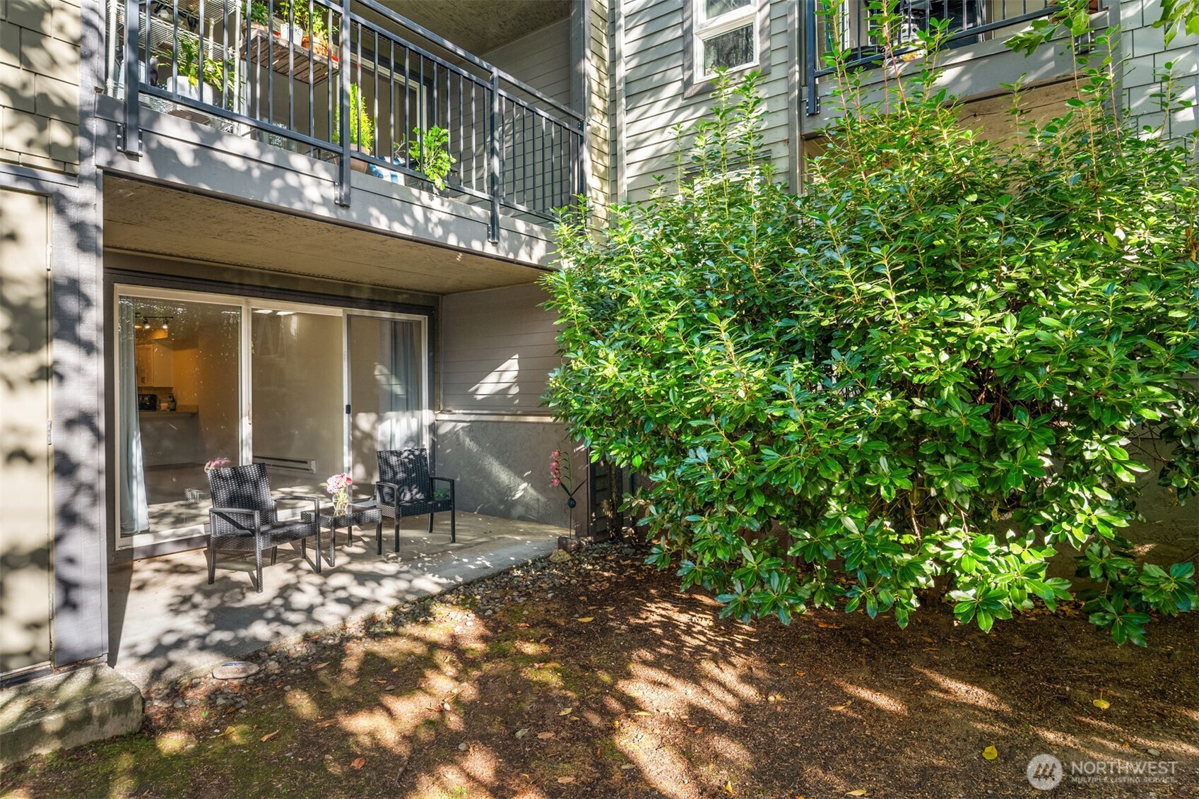 12014 98th Avenue Northeast, Unit 101 Kirkland, WA 98034 - Photo 9 of 33 a front view of a house with a yard